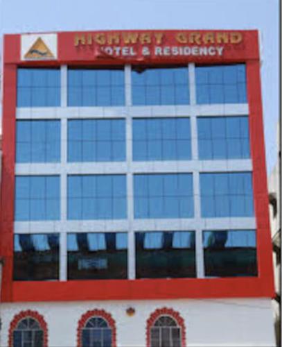 a building with a sign on the side of it at Highway Grand Residency in Hyderabad