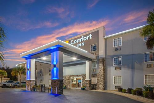 a front view of a hotel with a carport inn at Comfort Inn Pensacola near NAS Corry Station in Pensacola