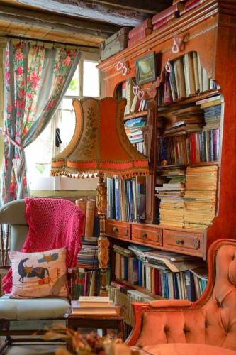 a room with a book shelf filled with books at Tina's Art Home - Venetian Walls District in Nicosia
