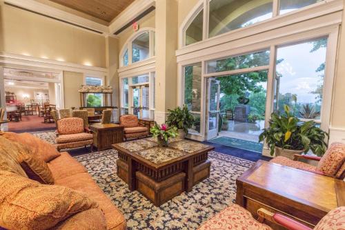 a living room with a couch and a coffee table at Cypress Bend Resort, a Wyndham Hotel in Many