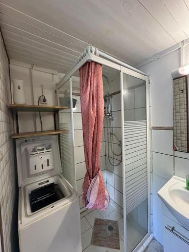 a small kitchen with a stove and a sink at Ti Kaz in Petit-Bourg