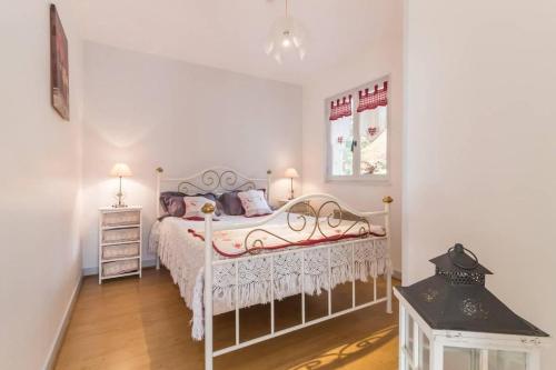 a bedroom with a bed and a window at Il était une fois in Champeau