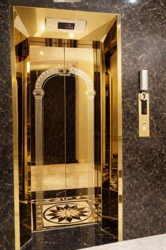 a bathroom with a shower with a glass door at Thành Trung Motel in Cat Ba