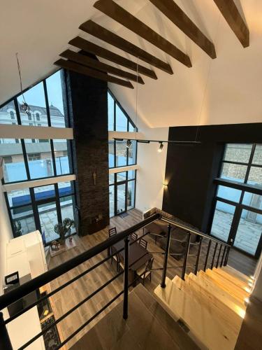 a room with stairs and a table in a building at Garden house for rent2 in Baku