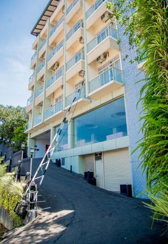a building with a ladder outside of it at Lavendish Hills Kandy in Kandy