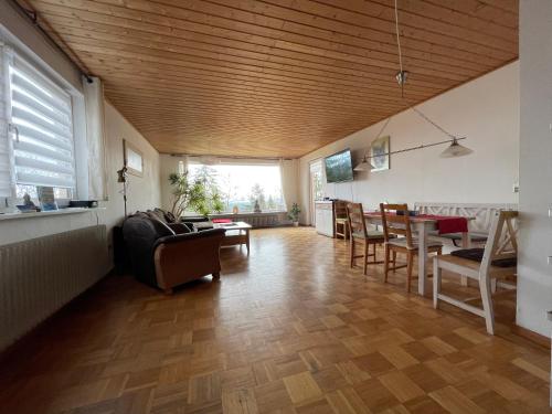 a living room with a couch and a table at Urlaubsort Fränkisches Seenland in Haundorf