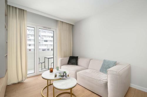 Beige and Green Two Bedroom Apartment in Poznań with Parking and Bathtub by Noclegi Renters