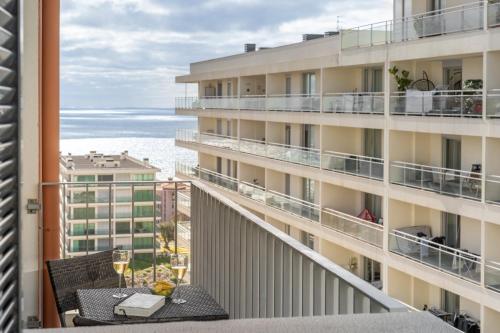 an apartment balcony with a view of the ocean at Camélia's Apartment I by An Island Apart, Lda in Funchal