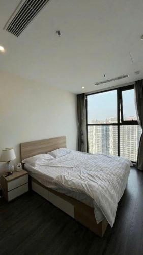 a bedroom with a bed and a large window at Homestay đẹp và rẻ r105 in Gia Lâm Pho