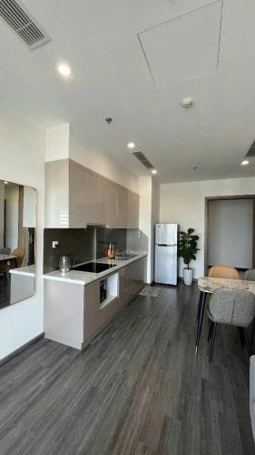 a large kitchen with a counter and a table at Homestay đẹp và rẻ r105 in Gia Lâm Pho