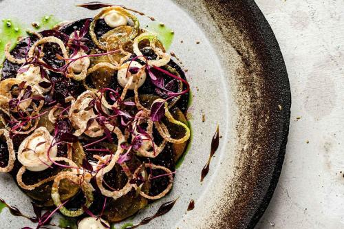 a plate with a salad with onions on it at Engels Traumwerk in Wertach