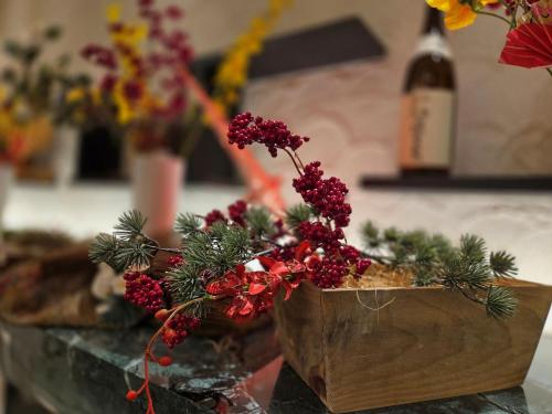 a vase filled with christmas decorations on a table at Richmond Hotel Akita Ekimae in Akita