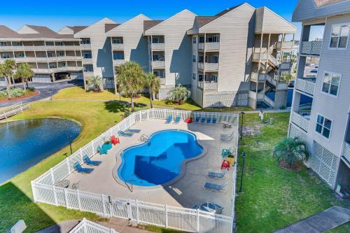 an aerial view of an apartment complex with a swimming pool at Third-floor beachfront condo with views washer&dryer heated pool in Pensacola Beach
