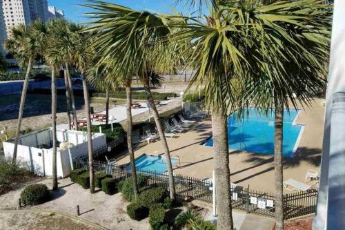 an aerial view of a resort with palm trees at Cozy top-floor beachfront condo with pool pool spa & beach access in Perdido Key