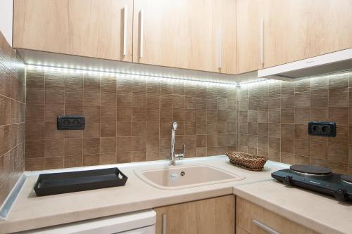 a kitchen with a sink and a counter at Villa Alissia in Koukounaries