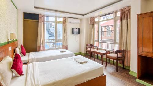 Rúm í herbergi á Nextdoor Thamel