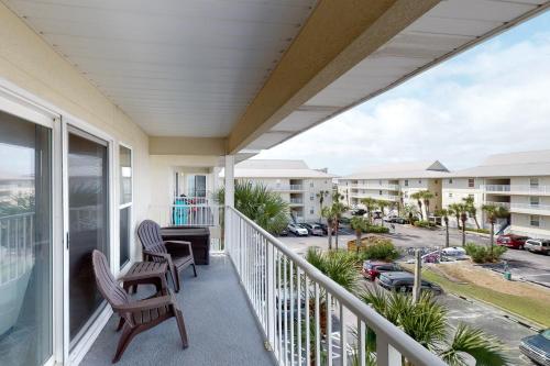 a balcony with a view of a parking lot at 3rd Floor Spacious Condo Close To Entertainment Shared pool Wifi in Navarre