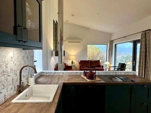 a kitchen with a sink and a counter top at Speuran Mora in Teangue