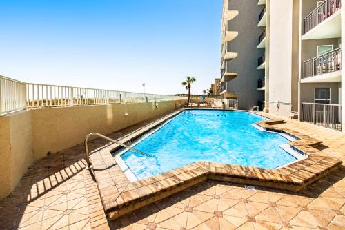 a swimming pool in the middle of a building at Spacious 3rd-floor beachfront condo with stunning views pool pickleball & AC in Fort Walton Beach
