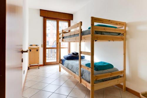 a room with two bunk beds and a window at Residenza Quadrifoglio in Cesena