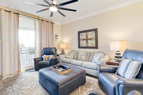 a living room with a couch and chairs at First Floor Condo with a Partial Gulf View Splash Pad and More in Fort Walton Beach