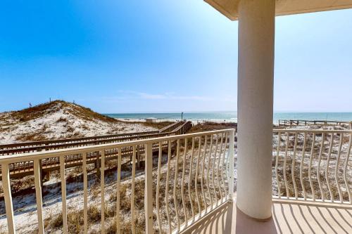 a balcony with a view of the beach at Ground floor beachfront condo with shared pool and beach access in Santa Rosa Beach