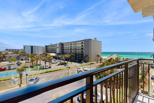 a balcony with a view of the ocean and buildings at Spacious home with balconies shared pool and beach access in Fort Walton Beach