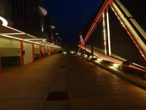 an empty hallway of a building at night at H Boutique Touca in Toluca
