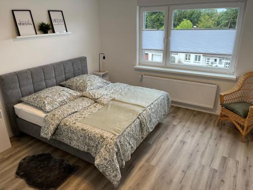 a bedroom with a bed and a window at Casa Forest Jump in Pirmasens