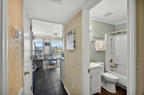 a bathroom with a toilet and a sink at SC304A: 304A Sea Cabin in Isle of Palms