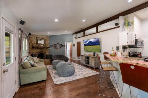 a kitchen and a living room with a couch at ArtLens Casa in Schertz