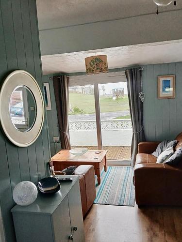 a living room with a couch and a table at Pensilva in Hayle