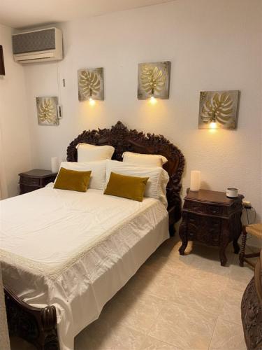 a bedroom with a large bed and a table at Luxuriöses Chalet mit privatem Pool in Roquetas de Mar