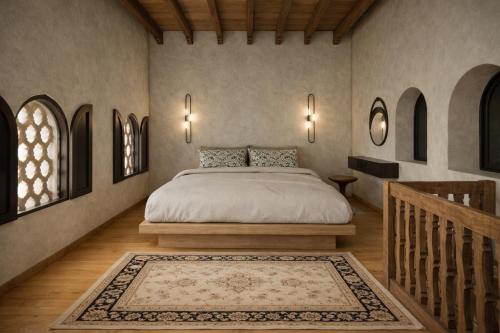 a bedroom with a bed and a staircase and windows at Fabrizio del Carretto in Rhodes Town