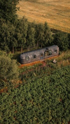 a train is going down the tracks in a field at Boath Cabin in Auldearn