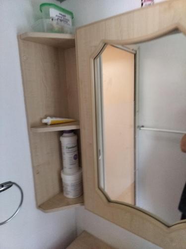 a mirror in the corner of a bathroom at Skegness Ingoldmells near Skegness raceway holiday let by Sophia in Ingoldmells