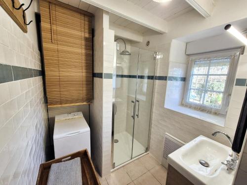 a bathroom with a shower and a sink at 690-Villa Ty Kastell in Audierne