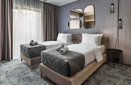 Un pat sau paturi într-o cameră la Hotel Experience