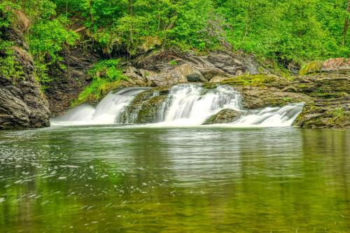 a waterfall in the middle of a body of water at Sruby Peřeje in Ostravice