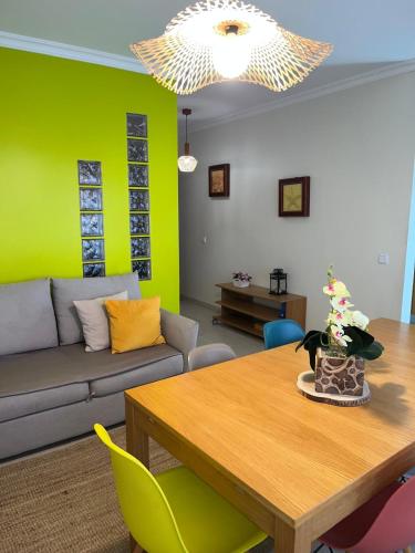 a living room with a couch and a table at BEIRA-MAR, Casinha Sub-Vila in Nazaré