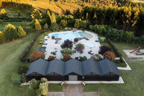 an aerial view of a garden with a swimming pool at Quinta das Mineirinhas in Vila Nova de Cerveira