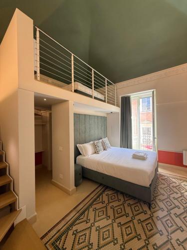 a bedroom with a loft bed and a staircase at Bellavitarooms-Fiore di Maggio Luxury Suites in Matera