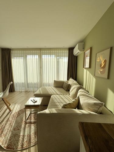 a living room with a couch and a table at Huisje Sille - Private studio in Volendam in Volendam