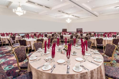 a large banquet hall with tables and chairs at Ramada by Wyndham State College Hotel & Conference Center in State College