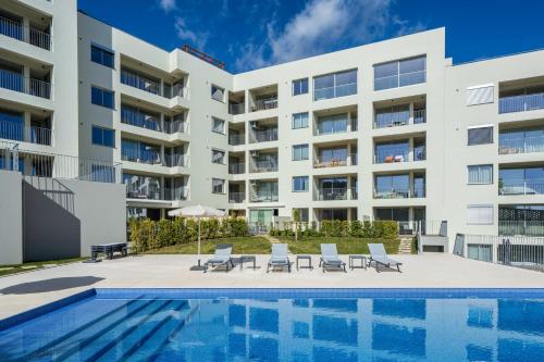 an image of a building with a swimming pool at BAsia Apartment by An Island Apart in Funchal