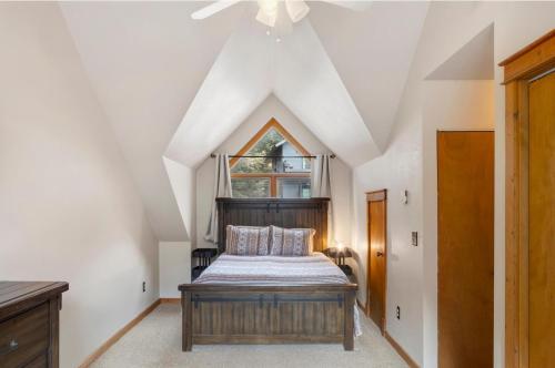 a bedroom with a bed and a window at River Park 1241 in Ouray