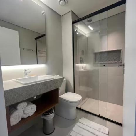 a bathroom with a sink and a toilet and a shower at Gav Muro Alto Resort below average rate in Ipojuca