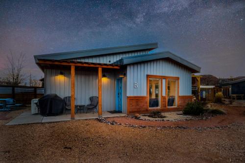 a small house at night with a starry sky at Timber & Tin B 1Bed 1Bath w Pool & Rooftop Deck in Kanab