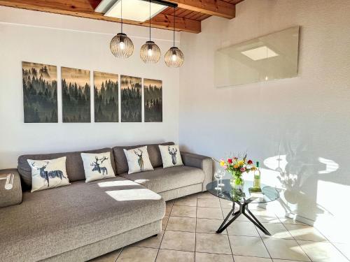 a living room with a couch and a table at Apartment Feingeist by Interhome in Löffingen