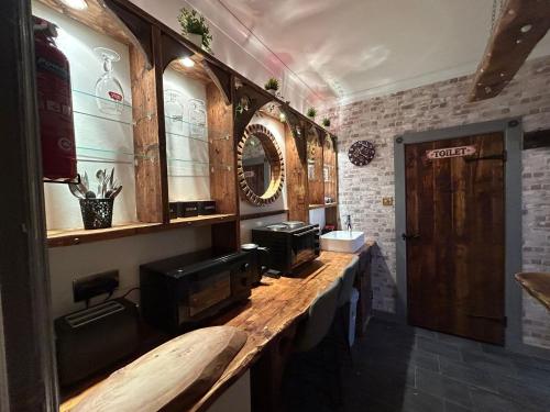a room with a long counter with a sink at Marton Lodge in Bridlington